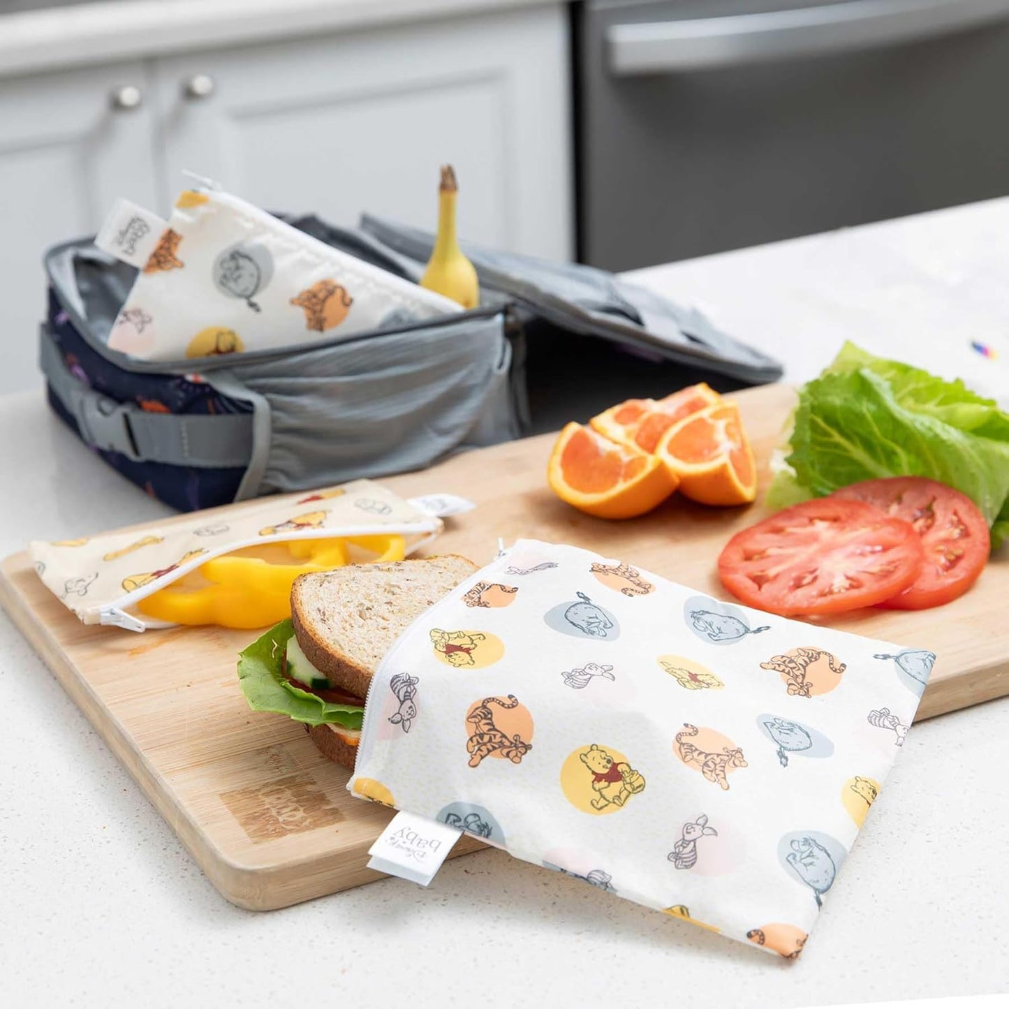 Bumkins - Cloth Snack & Sandwich Bags - For Storage, Travel, Food Prep, Lunch - Reusable, Water Resistant, Washable, Dishwasher Safe - Snack Bags for Kids - Zipper Closure - Winnie the Pooh - 4 Pack